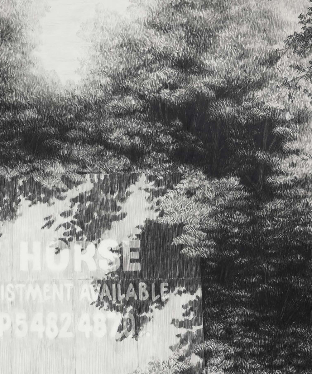 A sign, fence and horses