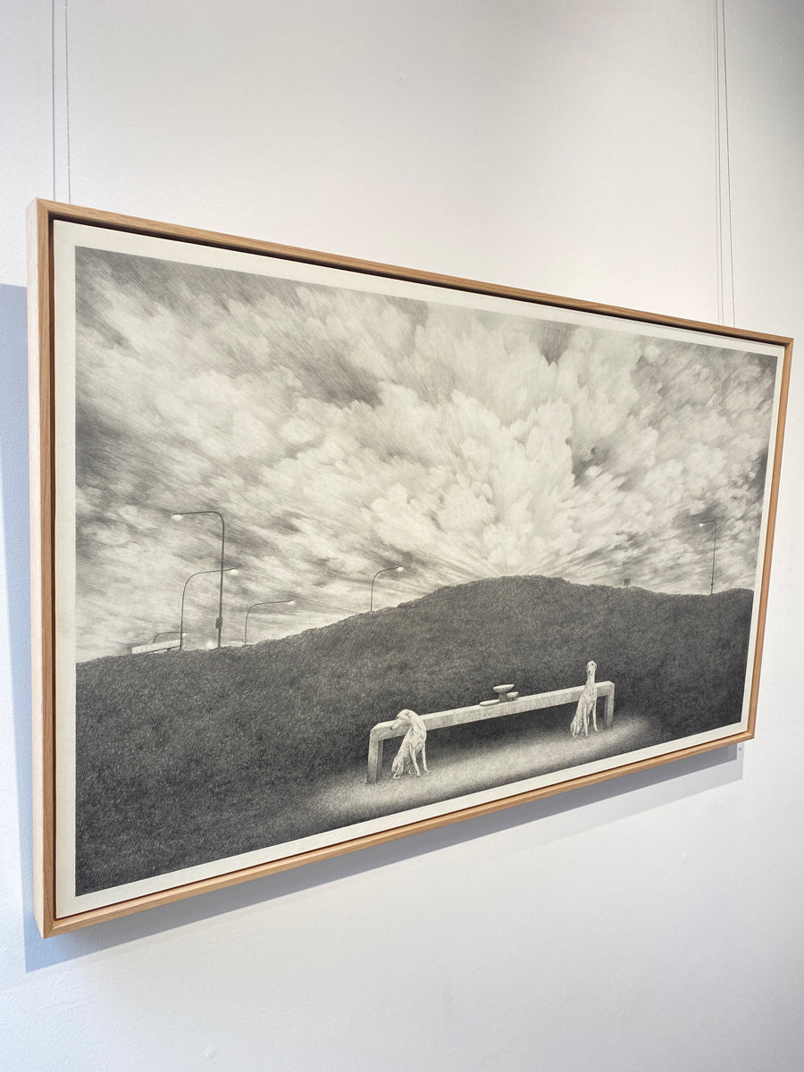 A pair of hounds, a stone table, empty bowls, a highway median strip