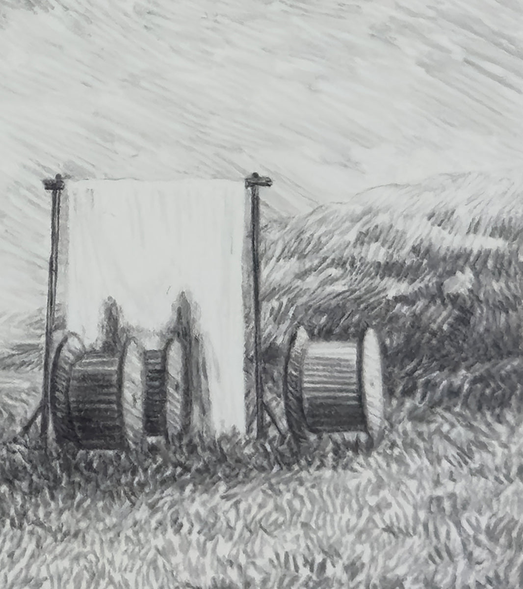 A field, spools, and shadows